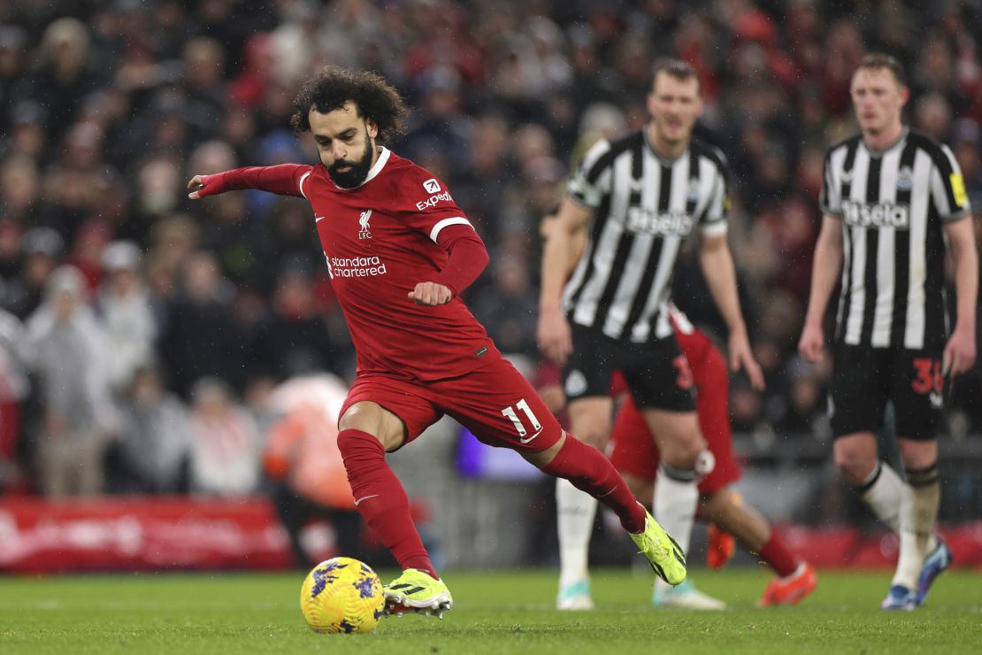 LIVERPOOL, ENGLAND - JANUARY 01: Mohamed Salah of Liverpool takes a penalty during the Premier League match between Liverpool FC and Newcastle United at Anfield on January 01, 2024 in Liverpool, England. (Photo by Jan Kruger/Getty Images)