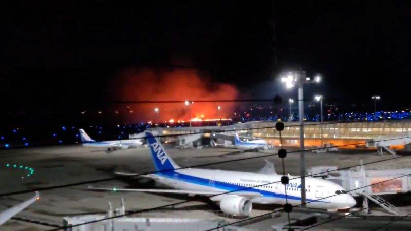 See moment planes collide at Tokyo airport