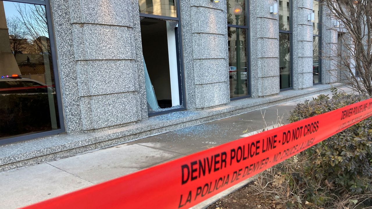 Police tape blocks the damage to large windows at the Colorado Supreme Court on Tuesday, Jan. 2, 2024 in Denver.   Authorities say a man inflicted "extensive damage" to the building housing.  (AP Photo/Colleen Slevin)