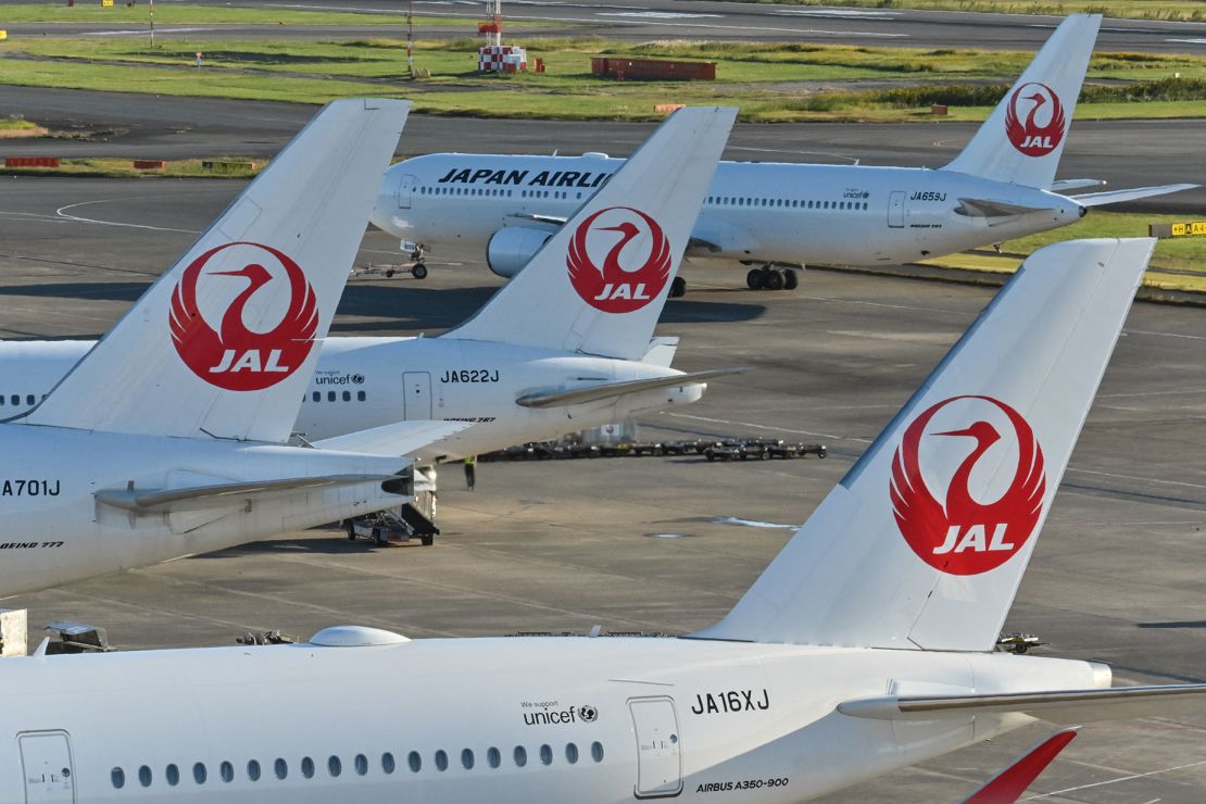 This photo taken on October 31, 2022 shows passenger planes for Japan Airlines (JAL) on the tarmac at Tokyo International Airport at Haneda in Tokyo. - The Japanese airline will release second quarter earnings later in the day on November 1. (Photo by Richard A. Brooks / AFP) (Photo by RICHARD A. BROOKS/AFP via Getty Images)