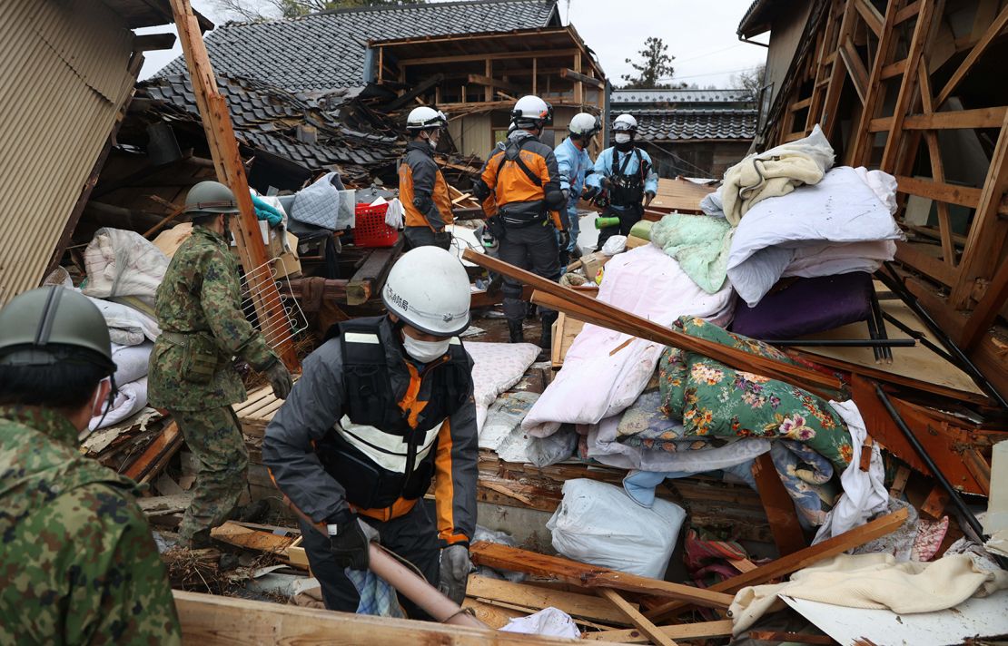 Japan earthquake Survivors in coats and hats at shelters without heat