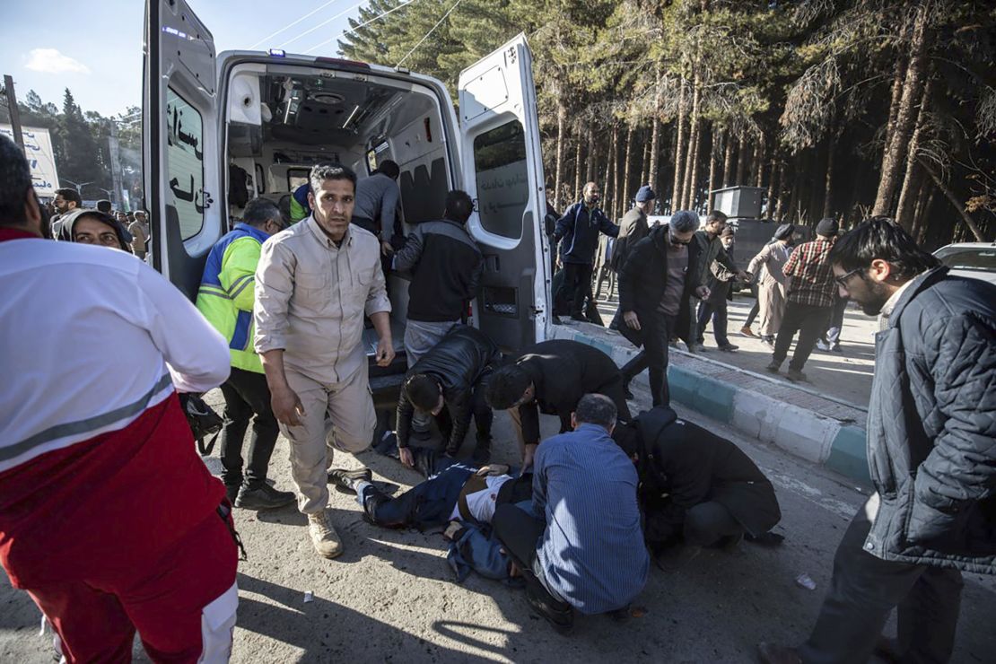 People take care of injured after an explosion in Kerman, Iran, Wednesday, Jan. 3, 2024. Explosions at an event honoring a prominent Iranian general slain in a U.S. airstrike in 2020 have killed at least 73 people and wounded over 170 others, state-run media in Iran reported Wednesday. (AP Photo/Mahdi Karbakhsh Ravari)