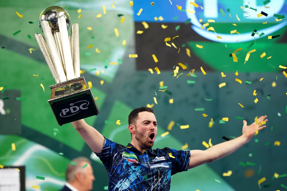 Luke Humphries celebrates with the trophy after defeating Luke Littler in the final of the Paddy Power World Darts Championship at Alexandra Palace in London. Photo date: Wednesday, January 3, 2024 (Photo by Zac Goodwin/PA Images via Getty Images)