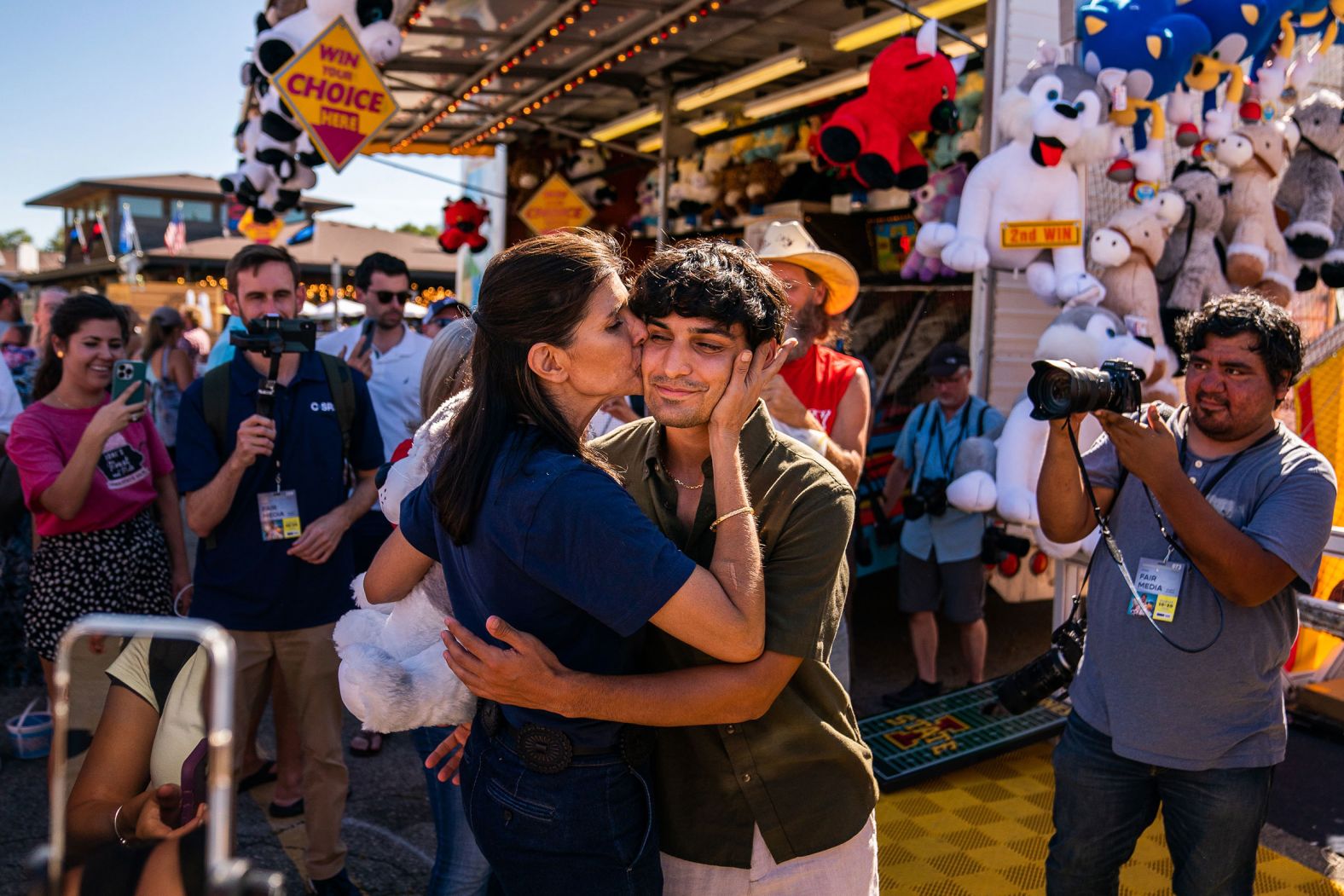 Haley kisses her son Nalin at the Iowa State Fair Grounds in August 2023.