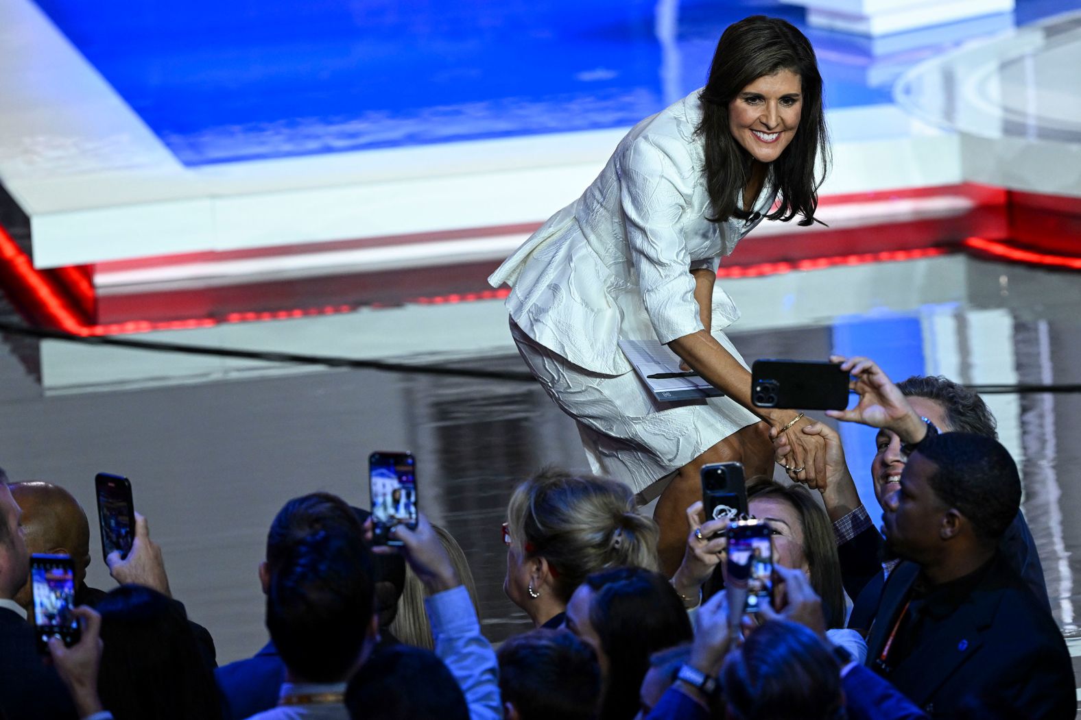 Haley poses for photos after a Republican presidential debate in Miami in November 2023.