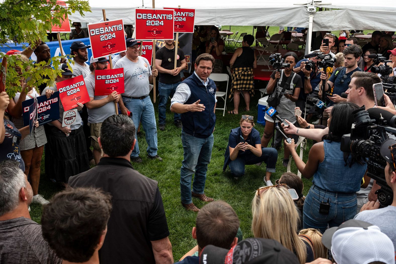 DeSantis speaks to reporters during an Iowa State University football game in Ames, Iowa, in September 2023.