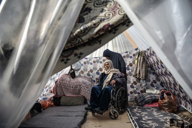 Palestinians displaced by Israeli bombardment take shelter in a makeshift tent in Rafah, Gaza on January 1, 2024.