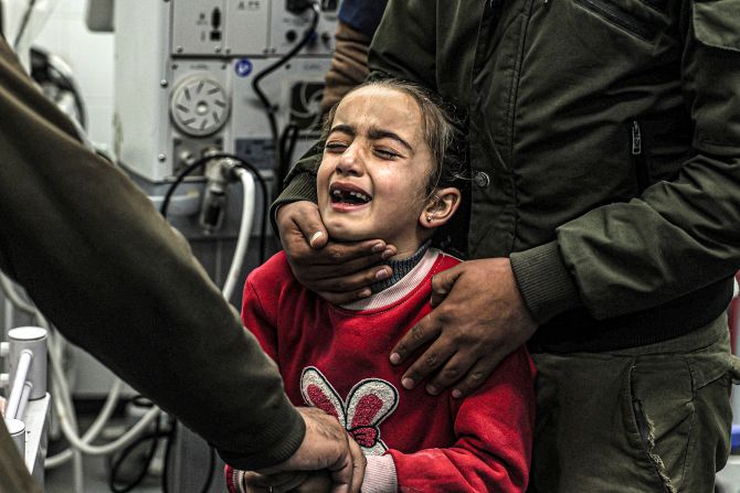 A girl mourns the death of her relatives who were killed by Israeli bombardment, at the European Hospital in Khan Yunis in the southern Gaza Strip on December 31.