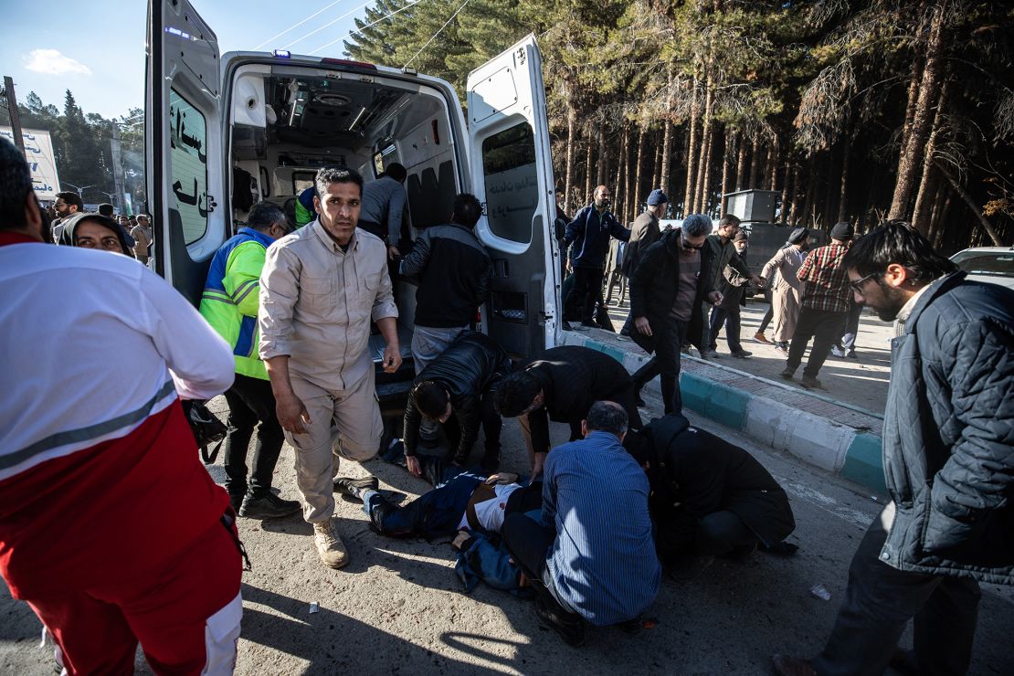 TOPSHOT - Iranian emergency services arrive at the site where two explosions in quick succession struck a crowd marking the anniversary of the 2020 killing of Guards general Qasem Soleimani, near the Saheb al-Zaman Mosque in the southern Iranian city of Kerman on January 3, 2024. The blasts, which state television called a "terrorist attack", came with tensions running high in the Middle East a day after Hamas number two was killed in a Beirut drone strike. The blasts stuck near the Saheb al-Zaman Mosque in Kerman, Soleimani's southern hometown where he is buried, as supporters gathered to mark the fourth anniversary of his death in a US drone strike just outside Baghdad airport. (Photo by MEHR NEWS / AFP) (Photo by -/MEHR NEWS/AFP via Getty Images)