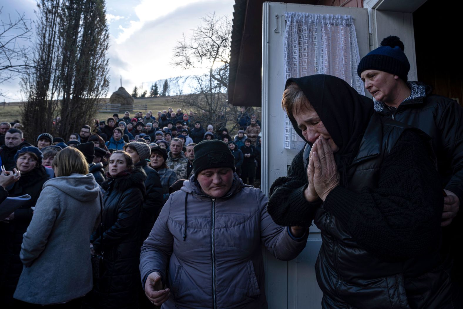 The mother of Ukrainian army officer Vasyl Medviychuk cries during her son's funeral ceremony in the village of Krasnyk on Friday, December 29. It has been nearly two years since Russia invaded Ukraine, starting a war that continues today.