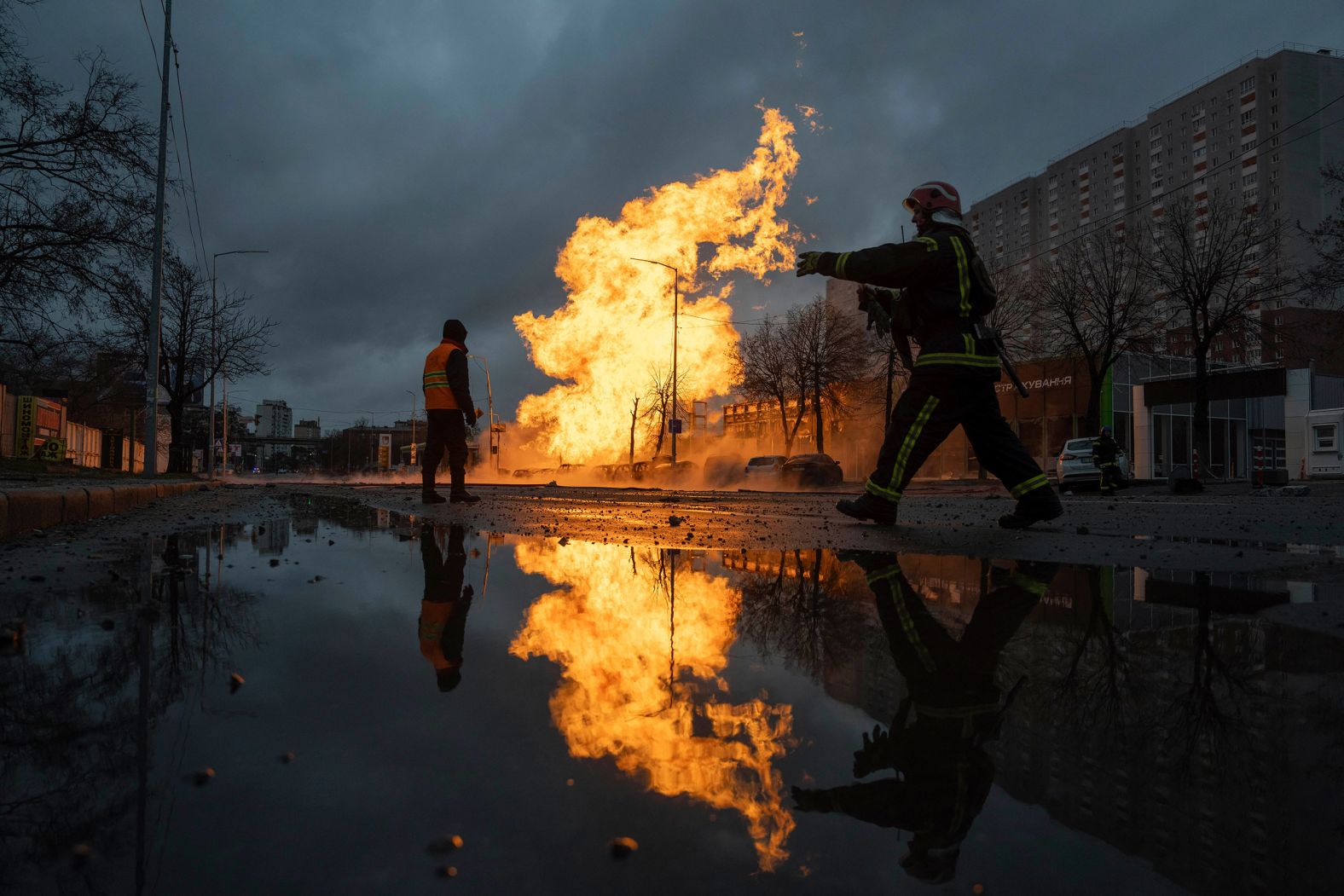 A firefighter works to extinguish a fire after a gas pipeline was damaged by a Russian rocket attack in Kyiv, Ukraine, on Tuesday, January 2.