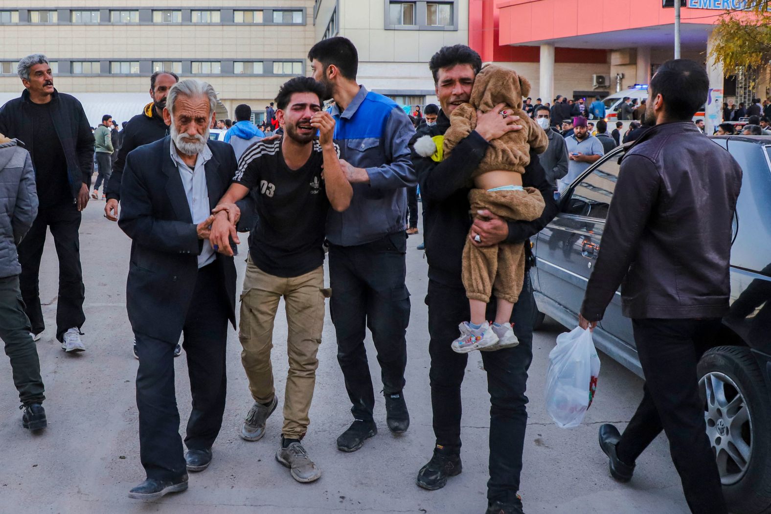 Injured people are helped outside a hospital in Kerman, Iran, on Wednesday, January 3, after there were two deadly explosions near the burial site of Qasem Soleimani, a military commander who was killed by a US airstrike four years ago. At least 84 people were killed and 284 were injured, according to the state-run news agency IRNA. <a href="index.php?page=&url=https%3A%2F%2Fwww.cnn.com%2F2024%2F01%2F04%2Fmiddleeast%2Firan-islamic-state-attack-kerman-intl%2Findex.html" target="_blank">ISIS claimed responsibility</a> for what was the deadliest attack in Iran since its 1979 revolution.