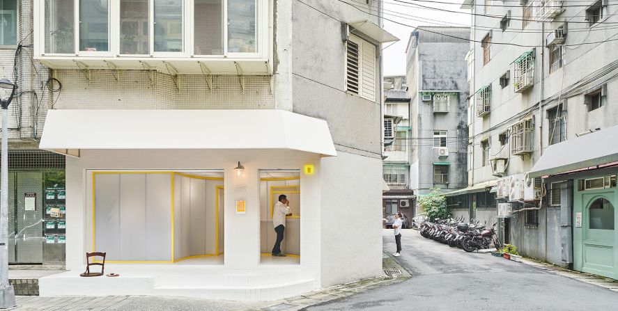 Fifteen Steps Workshop in Taipei, Taiwan. The minimalist cafe utilizes its sidewalk space as a "coffee deck" for customers and passers-by.