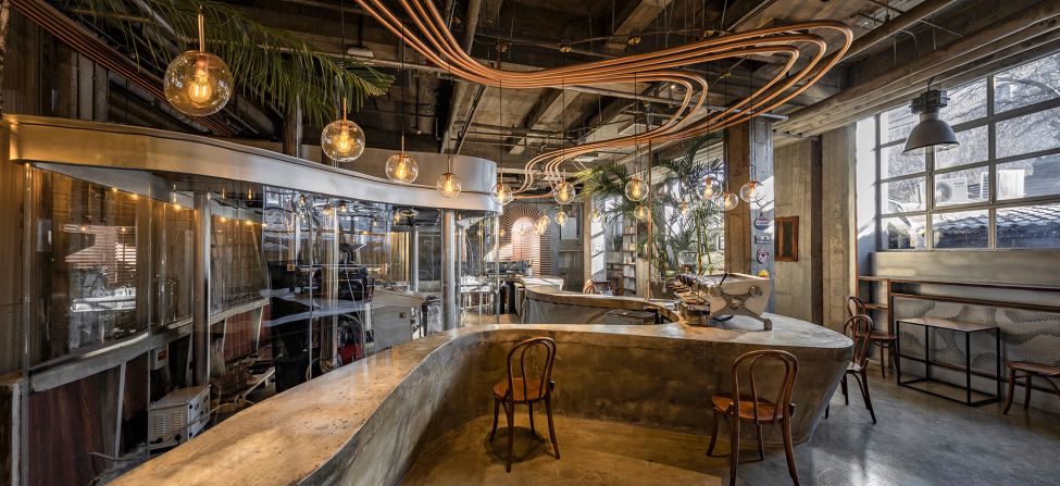 Metal Hands Coffee in Beijing, China. This café — a former dance theater and factory space — serves as the Chinese coffee chain's Beijing headquarters, and features an open-plan roastery and art space.