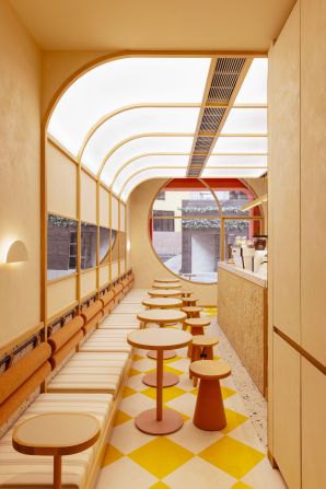 Melrose Coffee in Hong Kong, China. "Every aspect of the space exudes a cheerful West Coast optimism," Lani Kingston writes of the café, "from the gold lettering on the signage to the logo in ruby red embroidery on the aprons." 
