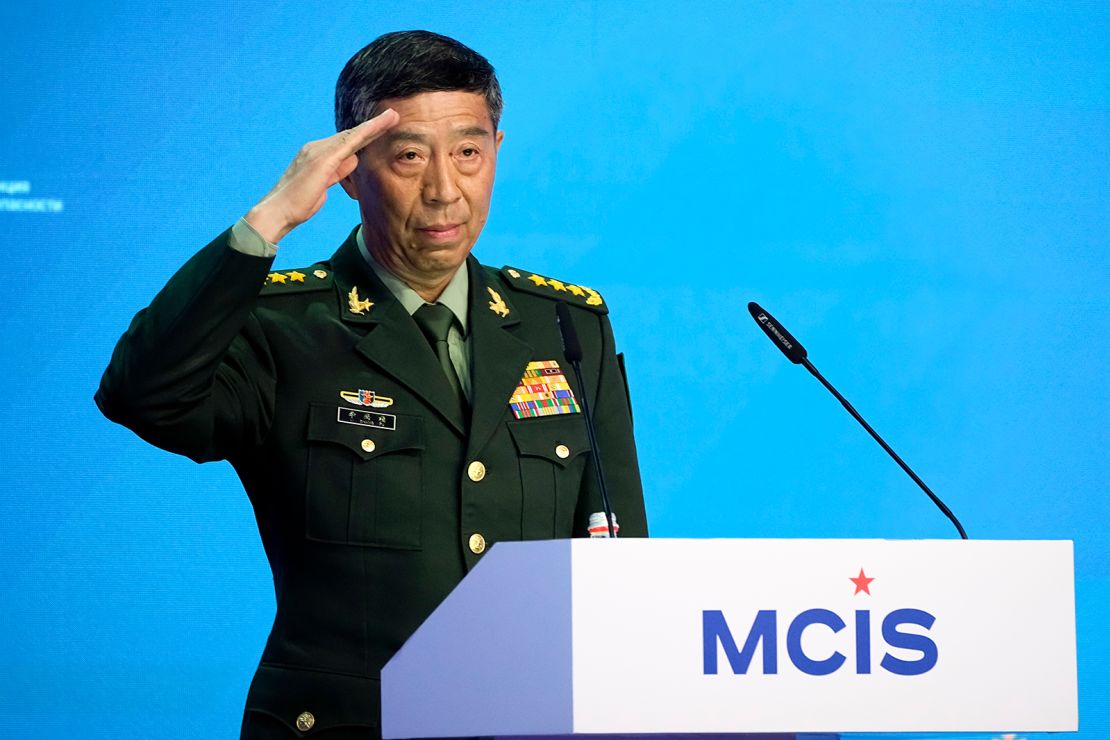 Chinese Defense Minister Li Shangfu salutes as he arrives to deliver his speech at the International Military Forum Army-2023 in the Patriot Park near Moscow in Moscow, Russia, Tuesday, August 15, 2023.