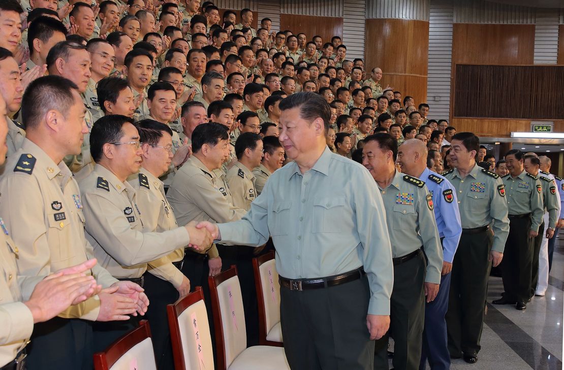 Chinese President Xi Jinping, also general secretary of the Communist Party of China (CPC) Central Committee and chairman of the Central Military Commission, shakes hands with delegates attending the first People's Liberation Army (PLA) Rocket Force Party congress during his inspection of the PLA Rocket Force, in Beijing, capital of China, September 26, 2016.