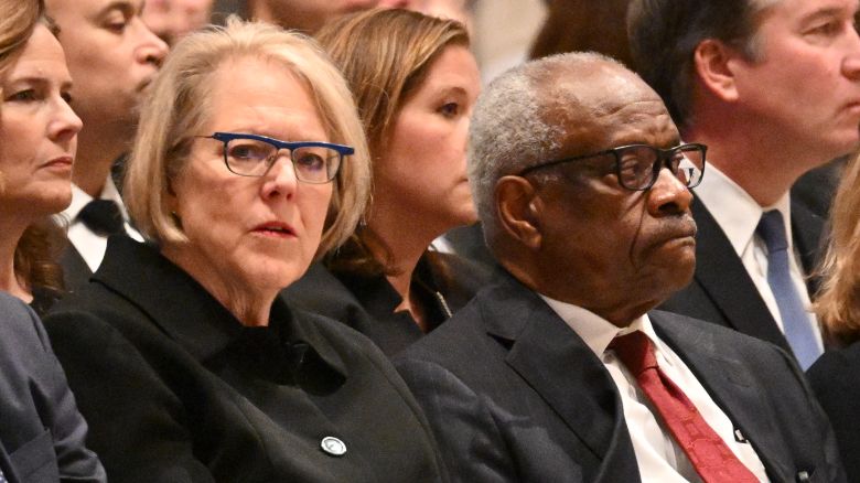 US Supreme Court justice Clarence Thomas and his wife Ginni Thomas attend a memorial service for former US Supreme Court Justice Sandra Day O'Connor at the National Cathedral in Washington, DC, on December 19, 2023. O'Connor, the first woman US Supreme Court justice, died on December 1, 2023 at 93 of complications related to advanced dementia and a respiratory illness. She served as one of the nine justices on the court until 2006 and wielded enormous influence as a crucial "swing vote" in a court evenly divided between liberals and conservatives. (Photo by Mandel NGAN / AFP) (Photo by MANDEL NGAN/AFP via Getty Images)