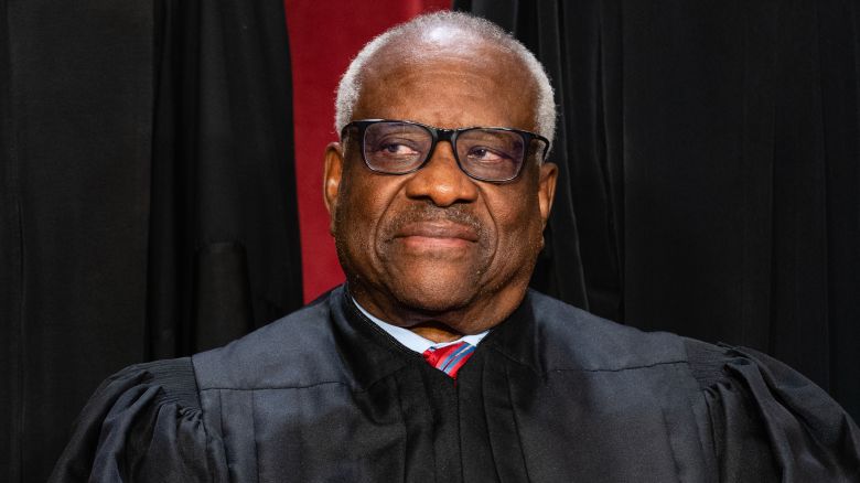Associate Justice Clarence Thomas during the formal group photograph at the Supreme Court in Washington, DC, US, on Friday, Oct. 7, 2022. The court opened its new term Monday with a calendar already full of high-profile clashes, including two cases that could end the use of race in college admissions. Photographer: Eric Lee/Bloomberg via Getty Images