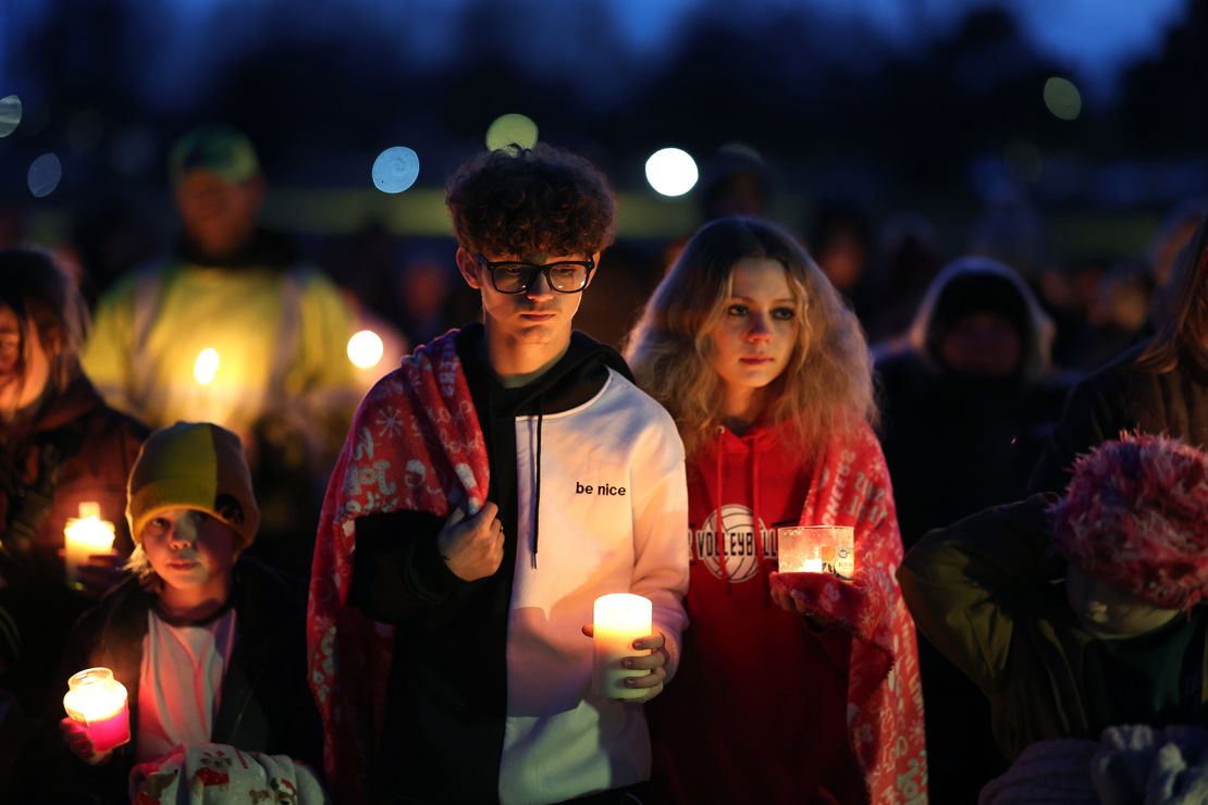 Community members gather in Wiese park for a candlelight vigil following the morning shooting at the Perry Middle School and High School complex on January 4, 2024 in Perry, Iowa.