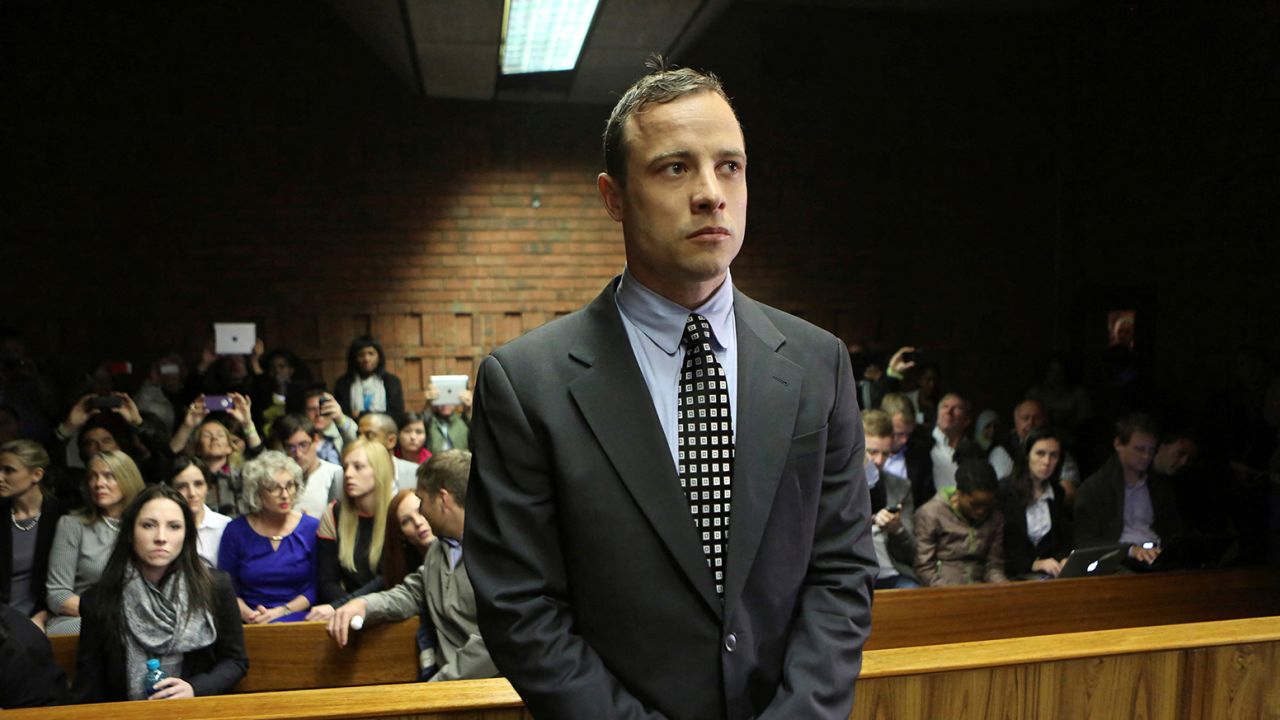 FILE PHOTO: Oscar Pistorius enters the dock before court proceedings at the Pretoria Magistrates court June 4, 2013. "Blade Runner" Pistorius arrived at court on Tuesday in his first formal appearance since his release on bail in February for the Valentine's Day killing of his girlfriend, 30-year-old model Reeva Steenkamp. 