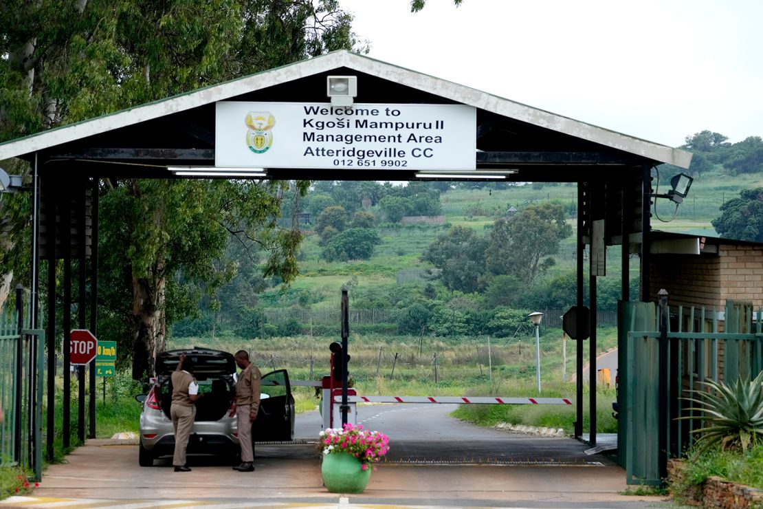 Prison officials search a car at the main entrance of the Atteridgeville Prison in Pretoria, South Africa, Friday, January 5, 2024.