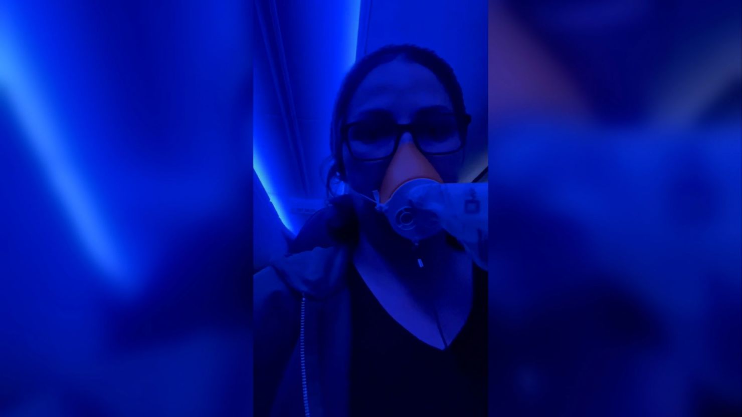 Stephanie King wears an oxygen mask while recording a video aboard her Alaska Airlines flight on Friday, January 5.