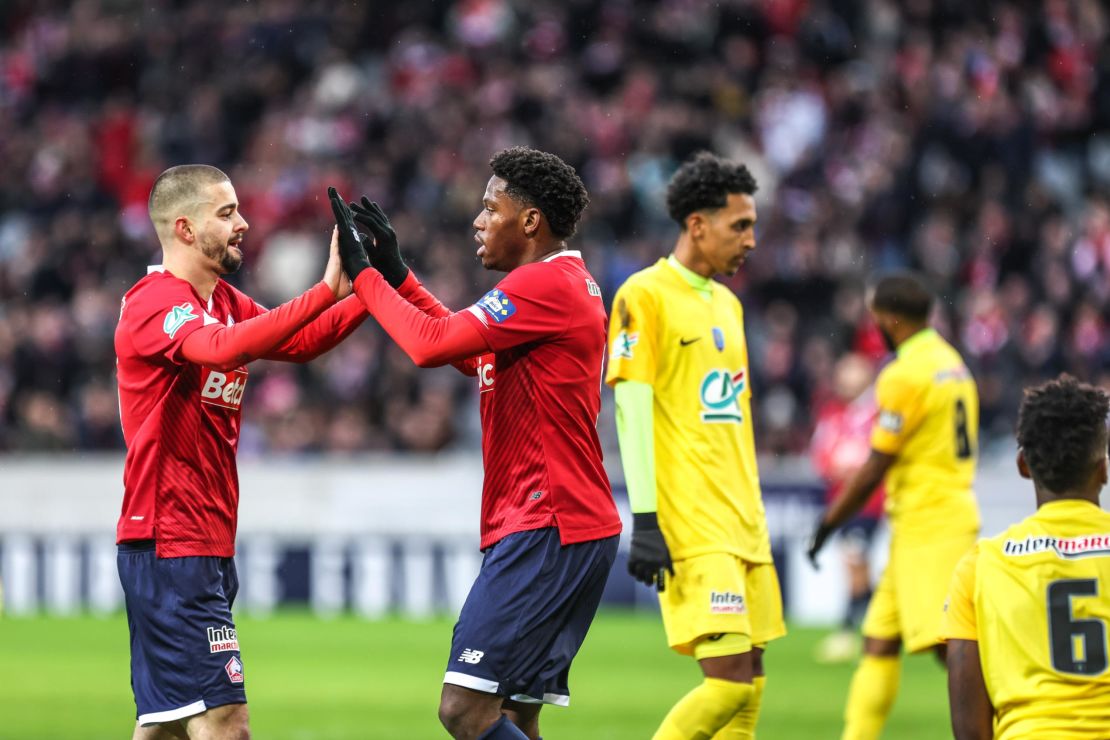 Jonathan DAVID of Lille celebrates his goal with Edon ZHEGROVA during the French Cup match between LOSC Lille and Golden Lion FC at Stade Pierre-Mauroy on January 6, 2024 in Lille, France.