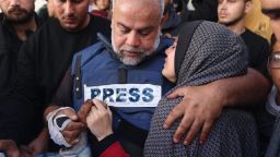 Al Jazeera's bureau chief in Gaza, Wael Al-Dahdouh (C) hugs his daughter during the funeral of his son Hamza Wael Dahdouh, a journalist with the Al Jazeera television network, who was killed in a reported Israeli air strike in Rafah in the Gaza Strip on January 7, 2024.