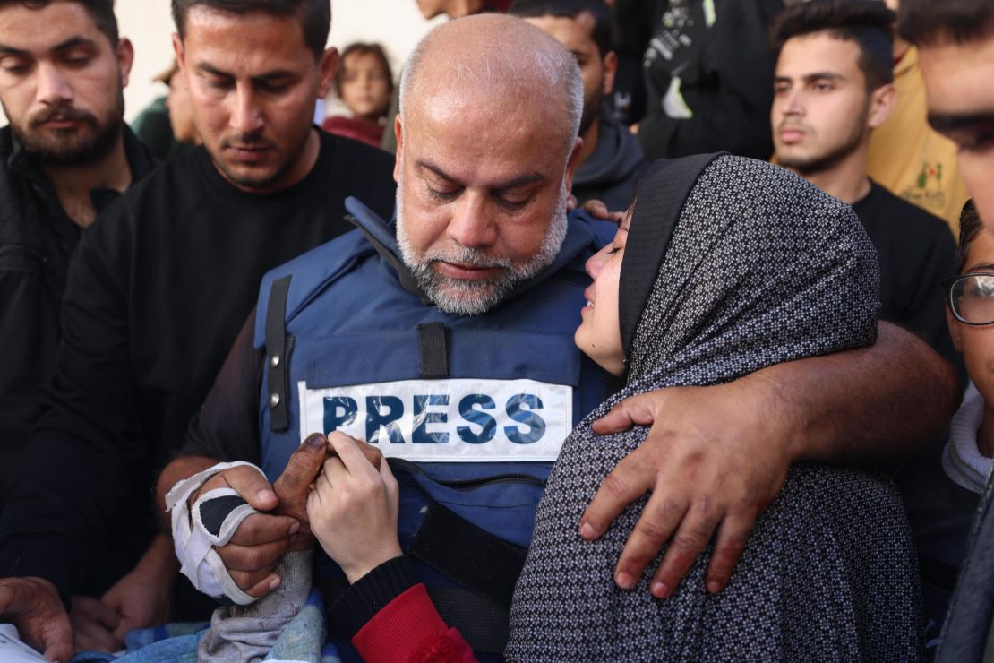 Al Jazeera's bureau chief in Gaza, Wael Al-Dahdouh (C) hugs his daughter during the funeral of his son Hamza Wael Dahdouh, a journalist with the Al Jazeera television network, who was killed in a reported Israeli air strike in Rafah in the Gaza Strip on January 7, 2024.