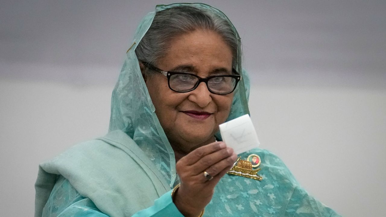 Bangladesh Prime Minister Sheikh Hasina shows her ballot paper as she casts her vote in Dhaka, Bangladesh, Sunday, Jan. 7, 2024. Polls have opened in Bangladesh as voters began casting their ballots in an election fraught with violence and a boycott from the main opposition party. (AP Photo/Altaf Qadri)