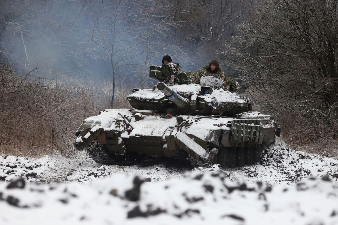 TOPSHOT - Ukrainian soldiers drive a tank in a position near to the town of Bakhmut, Donetsk region, on December 13, 2023, amid the Russian invasion of Ukraine. (Photo by Anatolii STEPANOV / AFP) (Photo by ANATOLII STEPANOV/AFP via Getty Images)