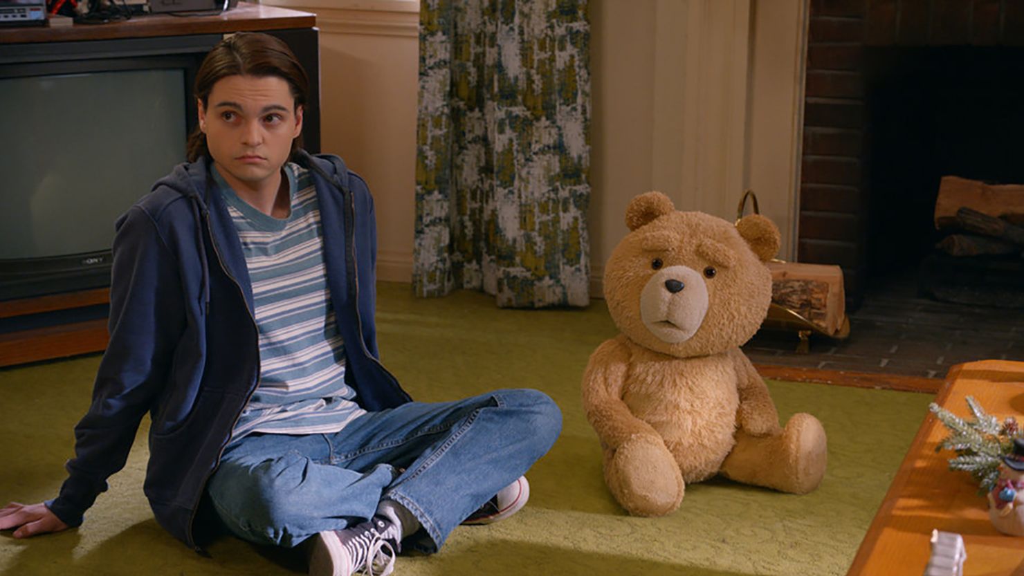 TED -- "Loud Night" Episode 106 -- Pictured: (l-r) Max Burkholder as John, Seth MacFarlane as voice of Ted -- (Photo by: PEACOCK)
