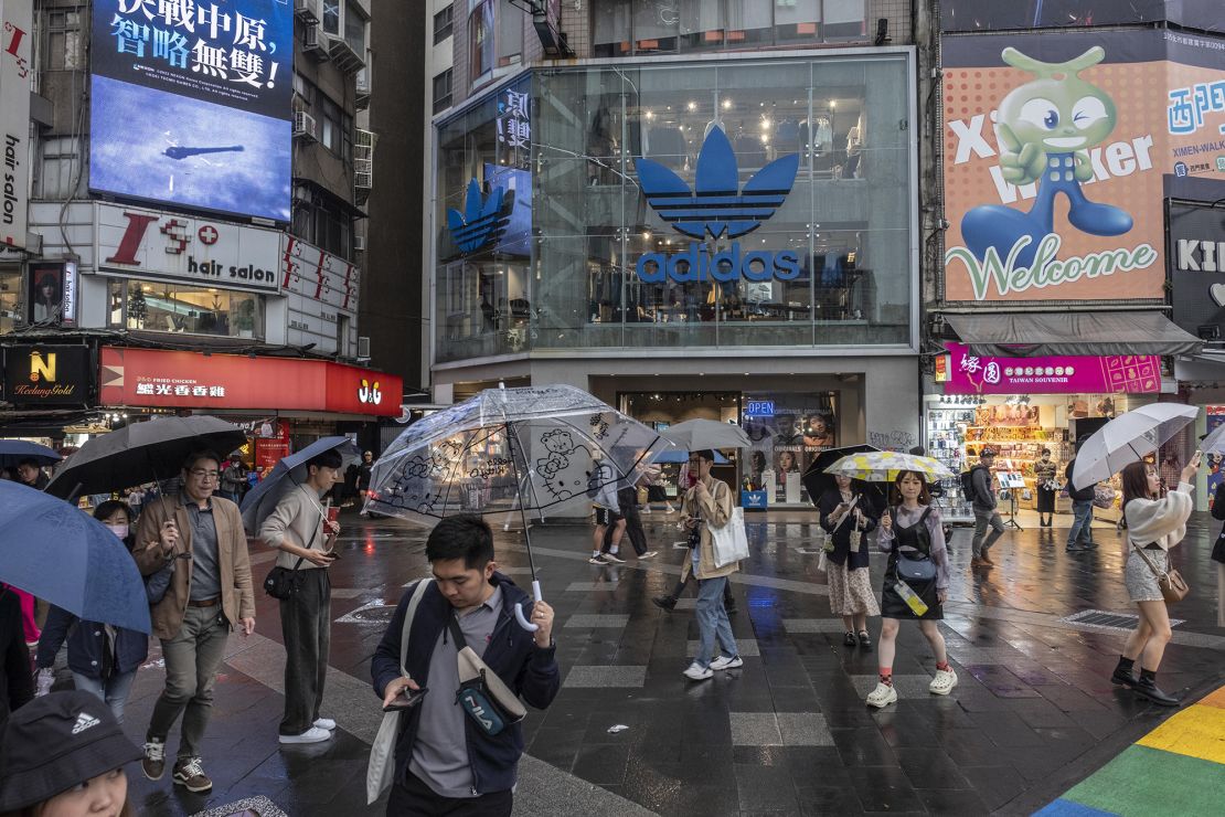 Pedestrians walk down a shopping street in Taipei, Taiwan, on Wednesday, Dec. 6, 2023. Taiwan's consumer prices rose more than economists expected in November. Photographer: Lam Yik Fei/Bloomberg via Getty Images