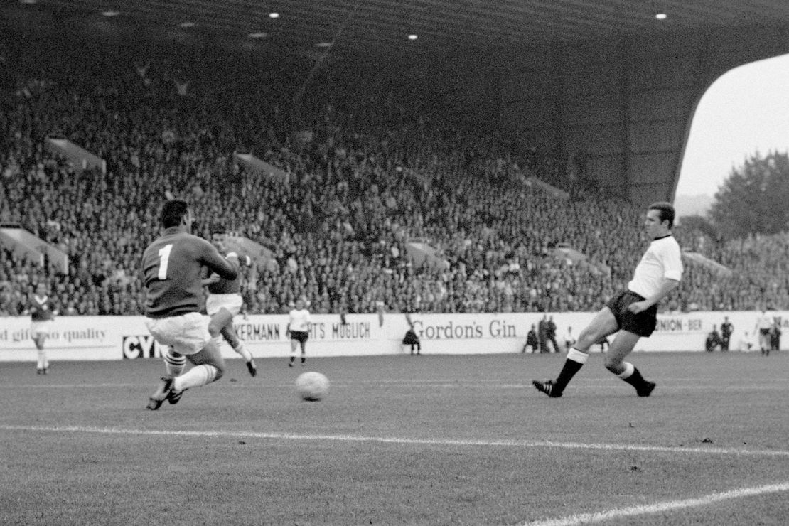 File photo dated 12-07-1966 of West Germany's Franz Beckenbauer (r) guides the ball past Switzerland goalkeeper Karl Elsener (l) to score his team's fourth goal. Beckenbauer, who led West Germany to World Cup glory as both a captain and manager, has died at the age of 78, his family said in a statement to German news agency DPA. Issue date: Monday January 8, 2024. 75018325 (Press Association via AP Images)