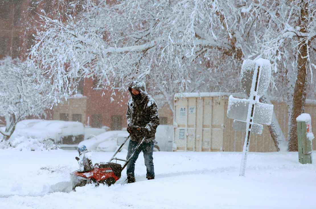 DES MOINES, IOWA - JANUARY 09: A person uses a snowblower to clear a sidewalk as a snowstorm dumps several inches of snow on the area on January 09, 2024 in Des Moines, Iowa. The weather system is bringing the first winter snowfall to central Iowa as voters prepare for the Republican Party of Iowa's presidential caucuses on January 15th. (Photo by Joe Raedle/Getty Images)