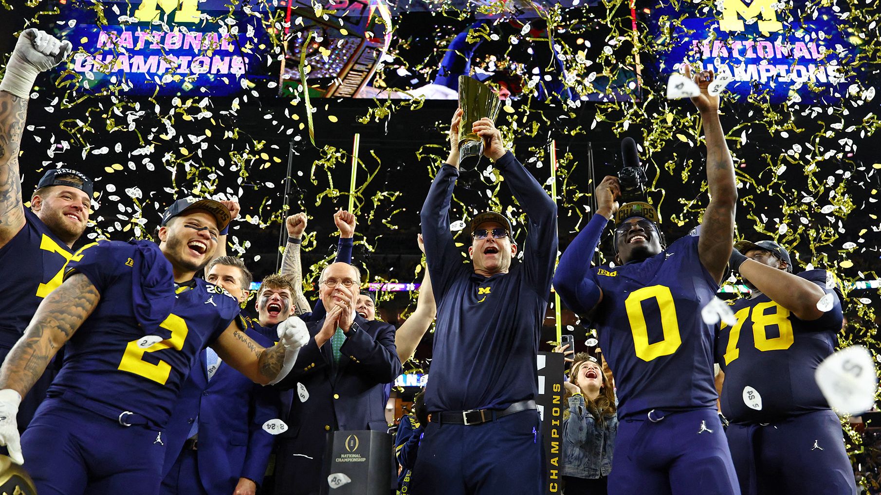 Jan 8, 2024; Houston, TX, USA; Michigan Wolverines head coach Jim Harbaugh holds the National Championship Trophy as he celebrates after winning 2024 College Football Playoff national championship game against the Washington Huskies at NRG Stadium. (Mark J. Rebilas/USA TODAY Sports/Reuters)