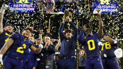 Jan 8, 2024; Houston, TX, USA; Michigan Wolverines head coach Jim Harbaugh holds the National Championship Trophy as he celebrates after winning 2024 College Football Playoff national championship game against the Washington Huskies at NRG Stadium. Mandatory Credit: Mark J. Rebilas-USA TODAY Sports
