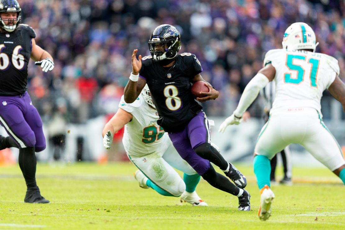 BALTIMORE, MARYLAND - DECEMBER 31: Lamar Jackson #8 of the Baltimore Ravens scrambles and runs with the ball during an NFL football game between the Baltimore Ravens and the Miami Dolphins at M&T Bank Stadium on December 31, 2023 in Baltimore, Maryland. (Photo by Michael Owens/Getty Images)
