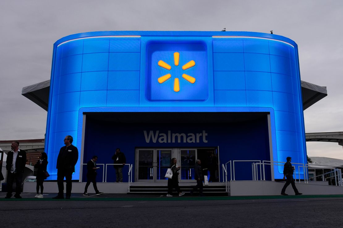 People walk by the Walmart booth during the CES tech show Tuesday, January 9, 2024, in Las Vegas.