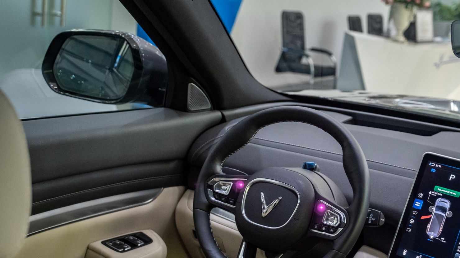 The steering wheel and the dashboard of VVinFast Auto Ltd. electric vehicle VF5 model on display inside the company's showroom in Hanoi, Vietnam, on Thursday, Sept. 7, 2023. VinFast is one of Vietnam's most high-profile companies, backed by the country's wealthiest man Pham Nhat Vuong  who has established Vingroup JSC, a conglomerate spanning homes, hotels, hospitals and shopping malls. The group, together with its affiliates and lenders, have deployed $8.2 billion to fund VinFast's operating expenses and capital expenditures the last six years. Photographer: Linh Pham/Bloomberg via Getty Images