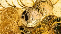 Bitcoin cryptocurrency background. A bunch of golden bitcoin, Digital currency