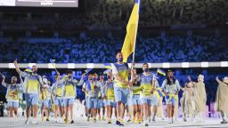 TOKYO, JAPAN - JULY 23: Flag bearers Olena Kostevych and Bogdan Nikishin of Team Ukraine during the Opening Ceremony of the Tokyo 2020 Olympic Games at Olympic Stadium on July 23, 2021 in Tokyo, Japan. (Photo by Matthias Hangst/Getty Images)