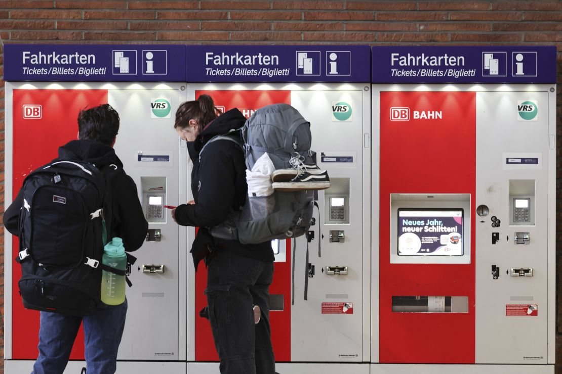 COLOGNE, GERMANY - JANUARY 10:  Travelers get information at an Deutsche Bahn ticket machine at city's main railway station on the first day of a 64-hour railway strike on January 10, 2024 in Cologne, Germany. The GDL labour union of locomotive drivers has launched the strike against Germany's state railway system Deutsche Bahn following recent negotiations over pay and working hours that the GDL claims has only produced inadequate proposals from Deutsche Bahn. The strike is due to end at 6pm on Friday. (Photo by Andreas Rentz/Getty Images)