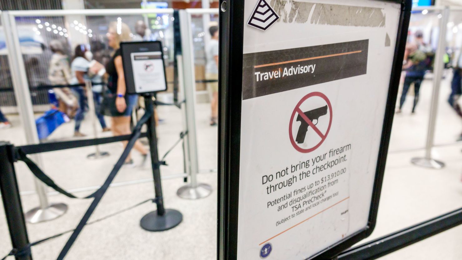 Miami, Florida, Miami International Airport MIA terminal, Transportation Security Administration TSA, check-point, travel advisory sign, firearms guns prohibited. (Photo by: Jeffrey Greenberg/Universal Images Group via Getty Images)