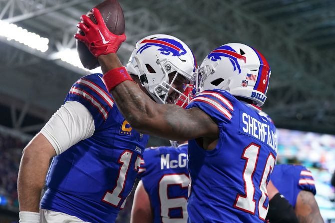 Buffalo Bills quarterback Josh Allen and wide receiver Trent Sherfield celebrate after a touchdown against the Miami Dolphins on Sunday, January 7. The Bills defeated the Dolphins 21-14 to win the AFC East title and clinch a home playoff game next week. The Dolphins — in first place for much of the season — had to settle for a wild-card spot.