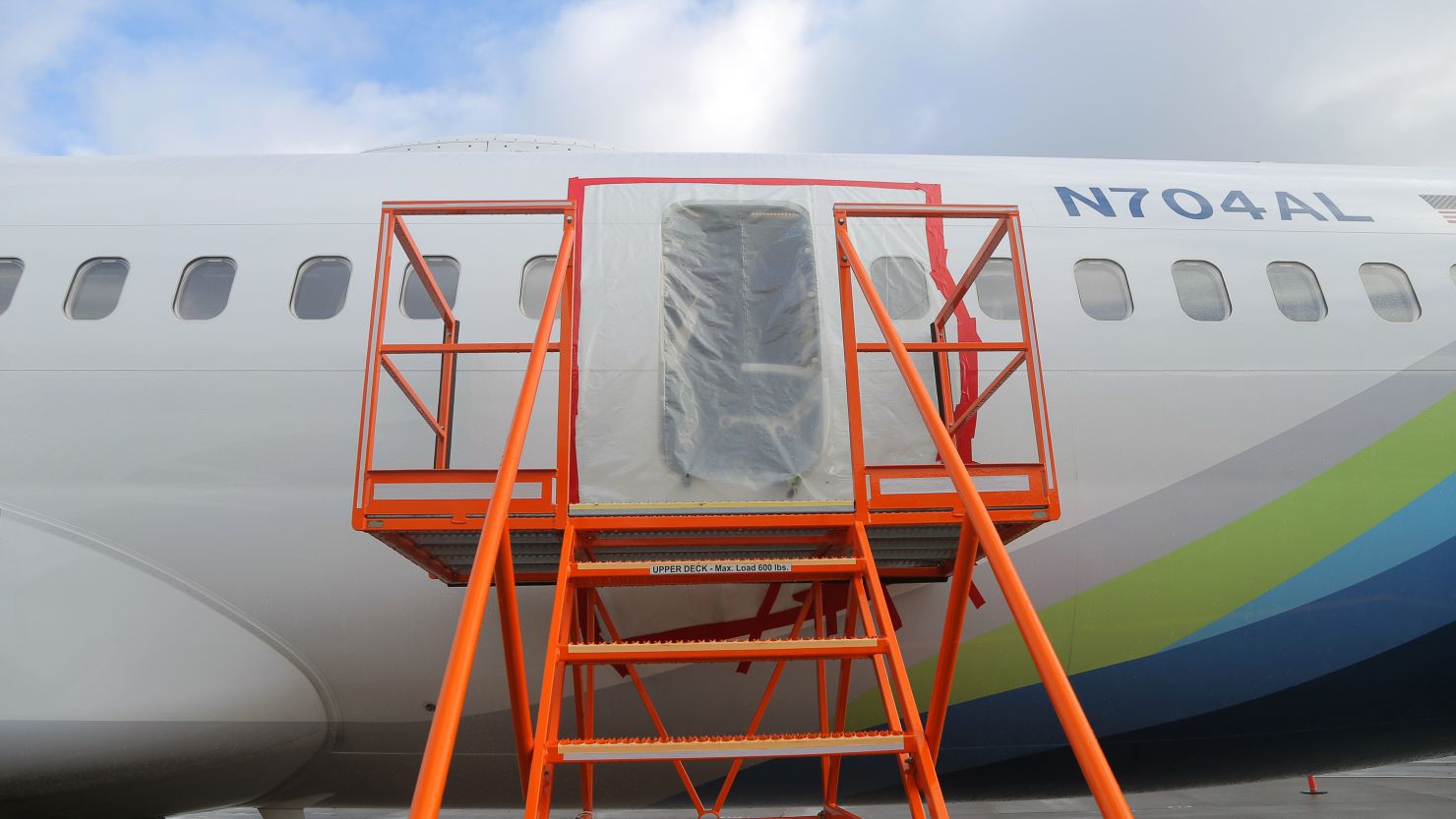PORTLAND, OREGON - JANUARY 7: In this National Transportation Safety Board (NTSB) handout, plastic covers the exterior of the fuselage plug area of Alaska Airlines Flight 1282 Boeing 737-9 MAX on January 7, 2024 in Portland, Oregon. A door-sized section near the rear of the Boeing 737-9 MAX plane blew off 10 minutes after Alaska Airlines Flight 1282 took off from Portland, Oregon on January 5 on its way to Ontario, California.  (Photo by NTSB via Getty Images)