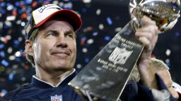 Bill Belichick, head coach of the New England Patriots holds the Vince Lombardi trophy after winning Super Bowl XXXVIII, 01 February 2004 at Reliant Stadium in Houston, Texas.  The Patriots beat the Carolina Panthers 32-29 to win the game.