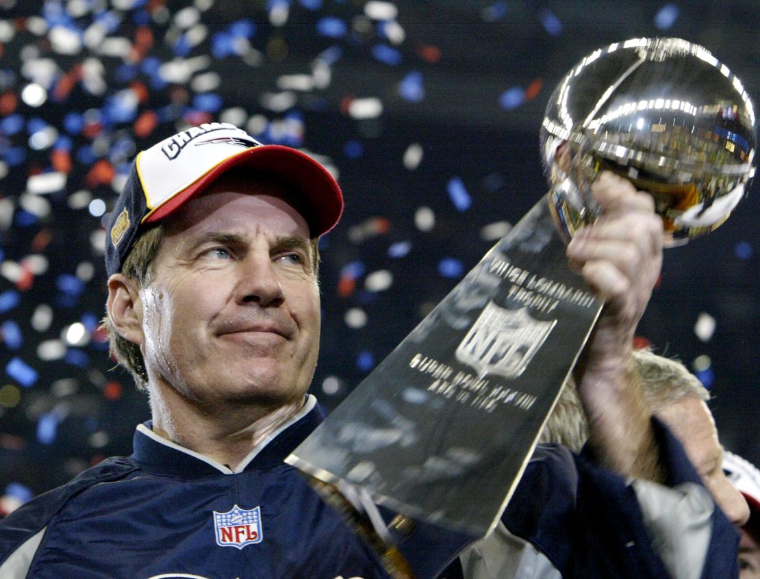 Bill Belichick, head coach of the New England Patriots holds the Vince Lombardi trophy after winning Super Bowl XXXVIII, 01 February 2004 at Reliant Stadium in Houston, Texas.  The Patriots beat the Carolina Panthers 32-29 to win the game.