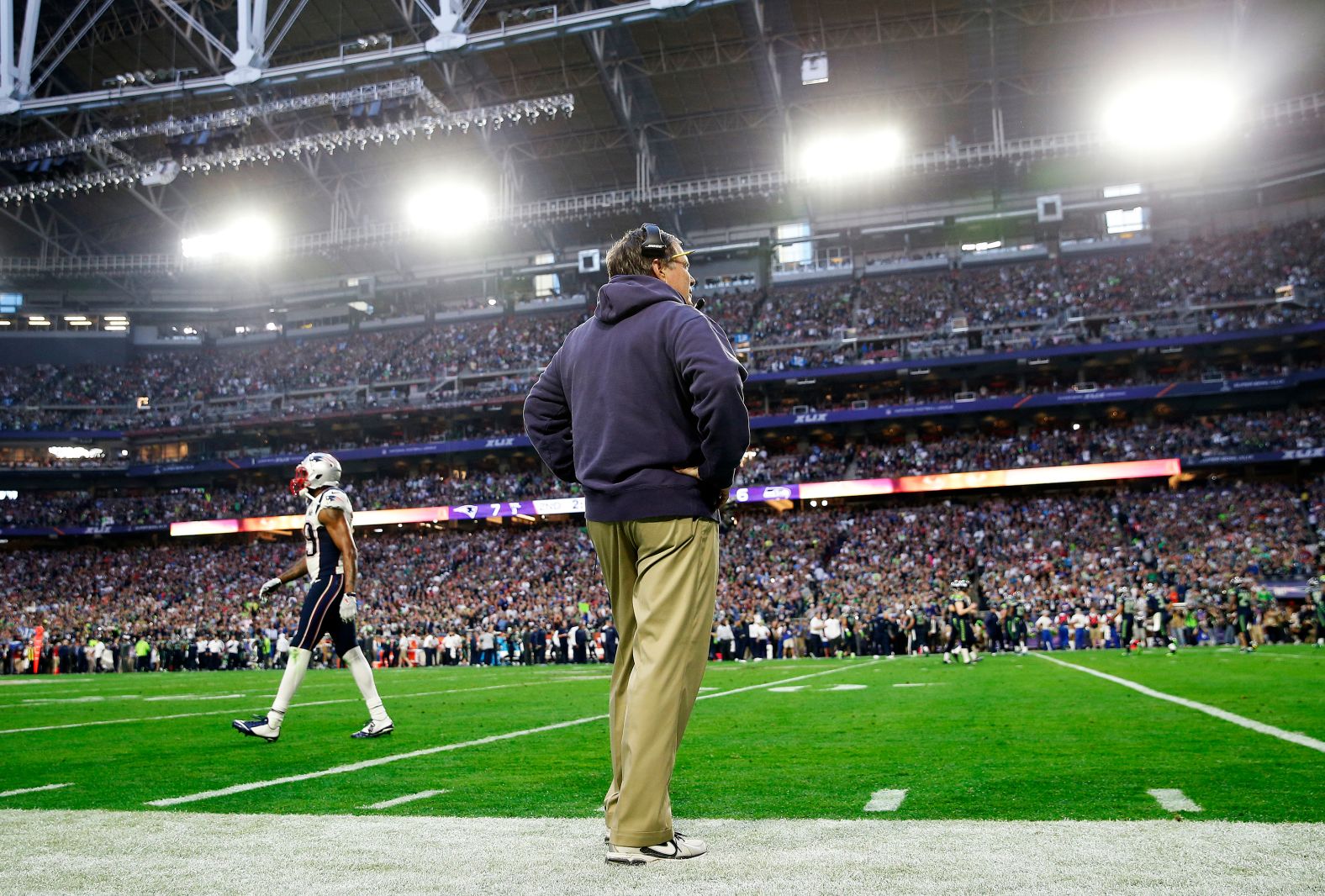 Belichick watches from the sideline as his team plays the Seattle Seahawks in the 2015 Super Bowl.